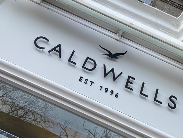 The Caldwells shopfront at 69 High Street, Lymington, with the bird motif and Est. 1996 lettering