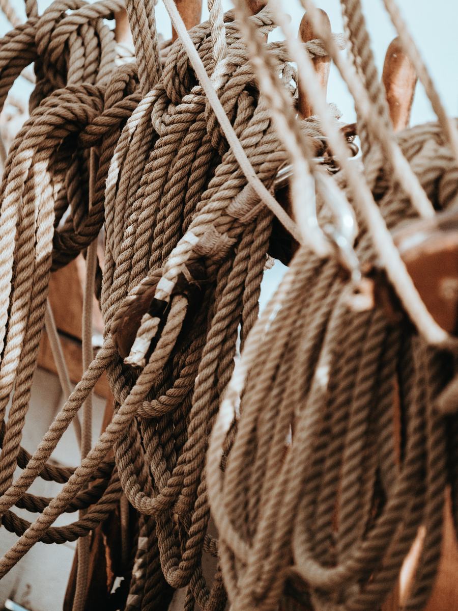 Coiled rigging ropes on a boat at Lymington quay